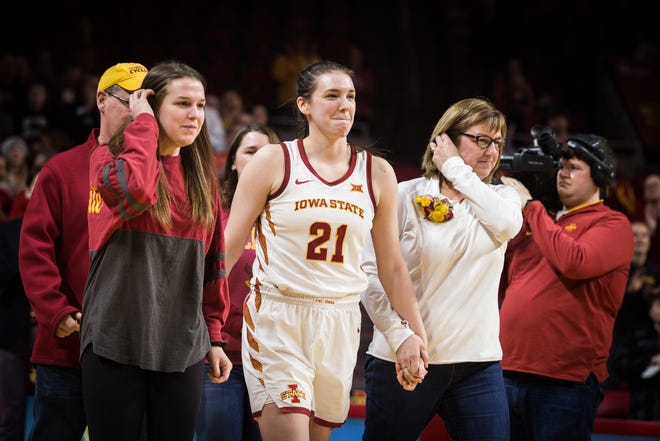 Iowa State's Bridget Carleton celebrates with her family and teammates on the Cyclones' Senior Night, Monday. Carleton led the Cyclones to a 69-49 win over Kansas with 20 points, 11 rebounds, 4 steals and 3 assists.