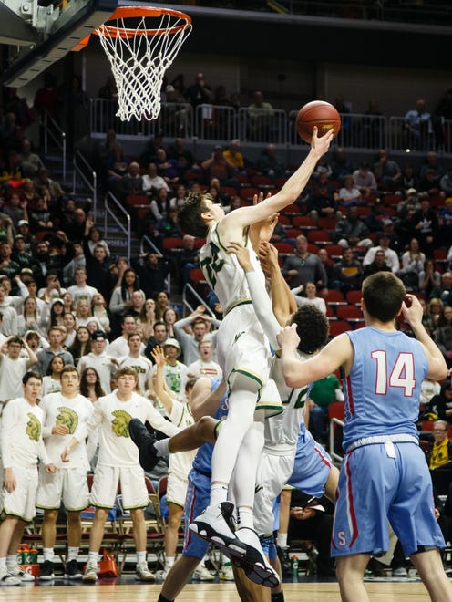 Iowa City West's Patrick McCaffery (22) tries to put in a rebound during their boys 4A state basketball tournament game on Wednesday, March 6, 2019 in Des Moines. Dubuque, Senior would go on to defeat Iowa City, West 39-36.