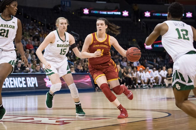 Iowa State Cyclones guard Bridget Carleton (21) dribbles past Baylor Lady Bears forward Lauren Cox (15) during the third quarter in the women's Big 12 Conference Tournament at Chesapeake Energy Arena.