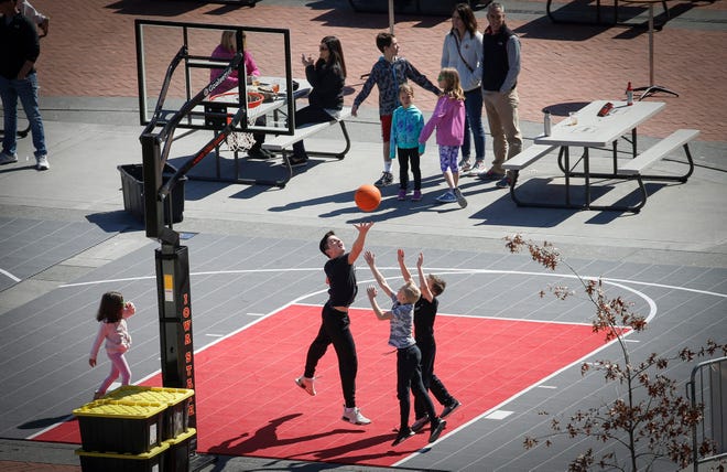 Young basketball fans play a game at Cowles Commons on Thursday, March 21, 2019, in Des Moines.