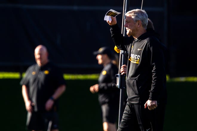 Iowa head coach Kirk Ferentz shields his eyes from the sun during the final spring football practice, Friday, April 26, 2019, at the University of Iowa outdoor practice facility in Iowa City, Iowa.