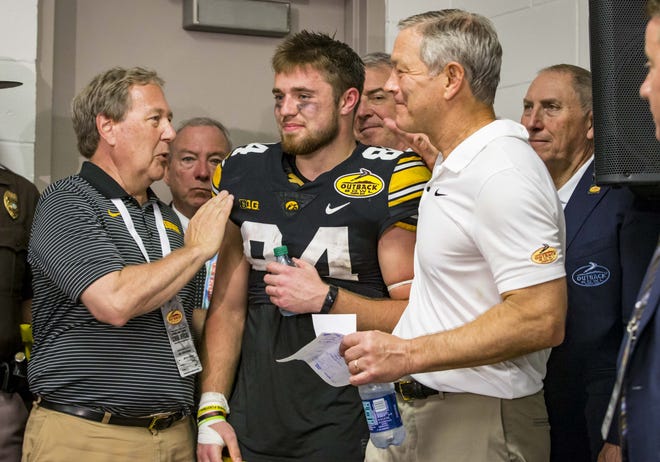 Iowa coach Kirk Ferentz (right, with Outback Bowl MVP Nick Easley) is visibly fitter than he was a decade ago.