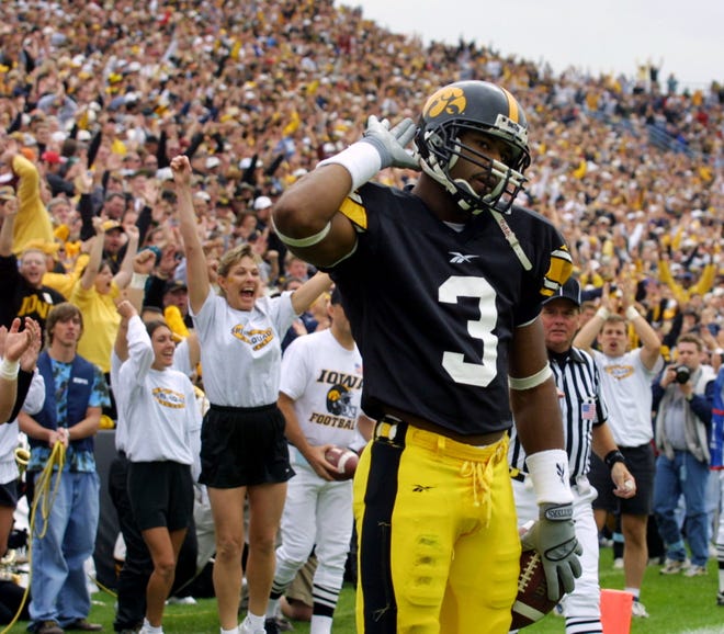 Iowa City native Kahlil Hill (1998, 2000-2001) motions toward the Kinnick Stadium crowd after scoring a touchdown against Penn State on Sept. 29, 2001. Hill finished his career with 152 catches for 1,892 yards and 15 touchdowns before spending time in the NFL and CFL.