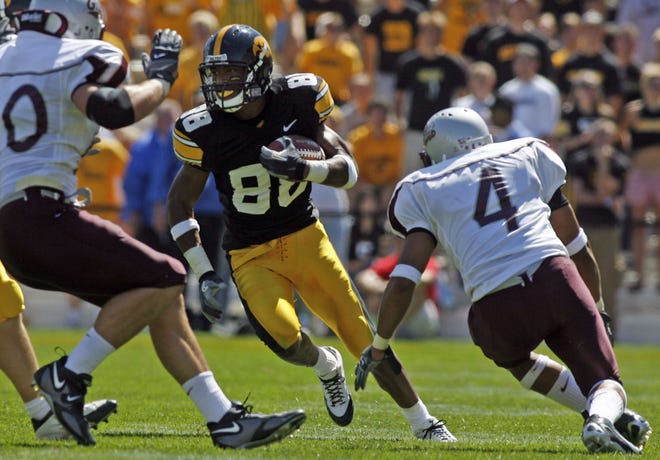 Dominique Douglas (2006) looks for a hole as Montana defenders close in at Kinnick Stadium on Sept. 2, 2006.
