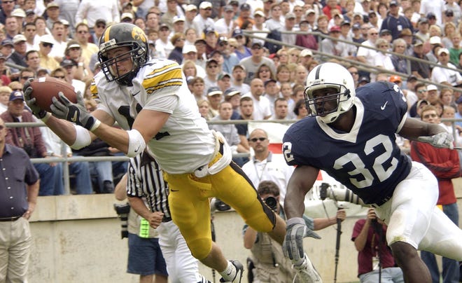 Ed Hinkle (2002-2005) pulls in a touchdown catch in the first half as Penn State's Bryan Scott defends on Sept. 28, 2002 in State College, Pa. Hinkel finished his career with 135 catches for 1,588 yards and 18 touchdowns. In his final game at Kinnick Stadium, Hinkel caught a record 4 touchdowns.