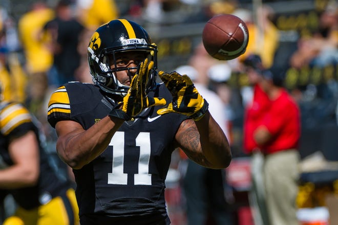 Kevonte Martin-Manley (2011-2014) left Iowa as the program's all-time receptions leader with 174, a record that stands today. He also accumulated 1,799 receiving yards and 14 touchdowns. He is pictured catching a pass against Ball State on Sept. 6, 2014 at Kinnick Stadium.