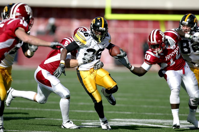 Paul Chaney, Jr. (2007-2010) takes the ball downfield after catching a pass from Ricky Stanzi during Iowa's contest against the Hoosiers on Nov. 6, 2010 in Bloomington, Ind.