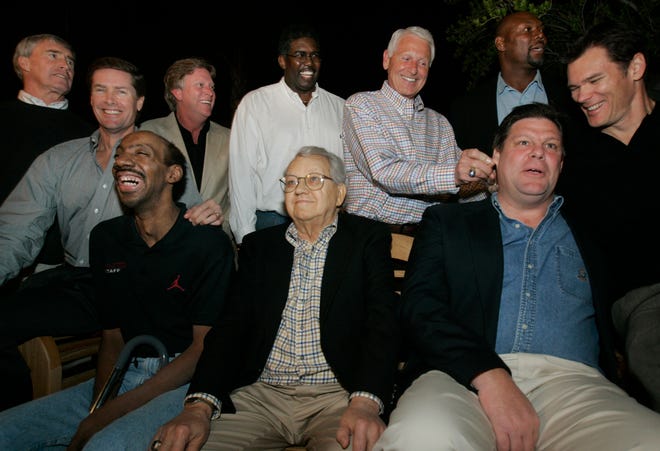Members of the 1980 Iowa Final Four team joke around before having their picture taken at former Arizona coach Lute Olson's home in Tucson, Arizona, in 2005. Kenny Arnold is bottom left.
