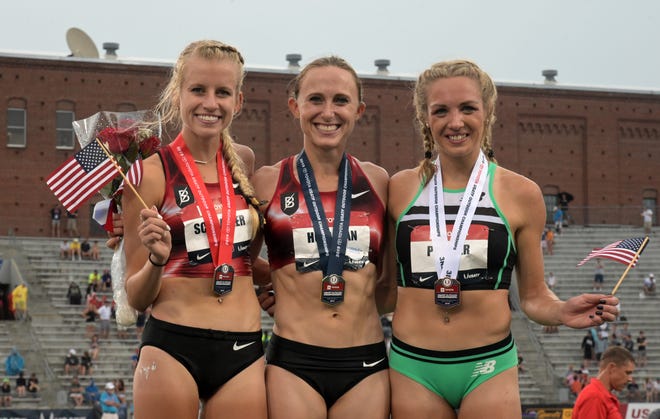 Women's 5,000 meters winner Shelby Houlihan (center) poses with runner-up Karissa Schweizer (left) and third-place finisher Elinor Purrier at the USATF Championships at Drake Stadium on Sunday, July 28, 2019, in Des Moines.