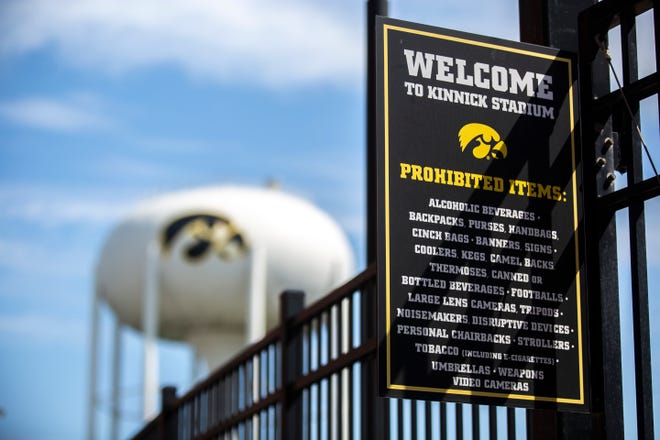A sign lists prohibited items inside the stadium at a gate near the Tigerhawk painted water tower, Saturday, Aug. 3, 2019, at Kinnick Stadium in Iowa City, Iowa.