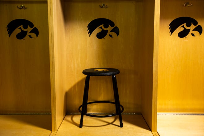 A stool sits inside a locker below a Tigerhawk logo during a behind the scenes tour, Friday, Aug. 23, 2019, at Kinnick Stadium in Iowa City, Iowa.