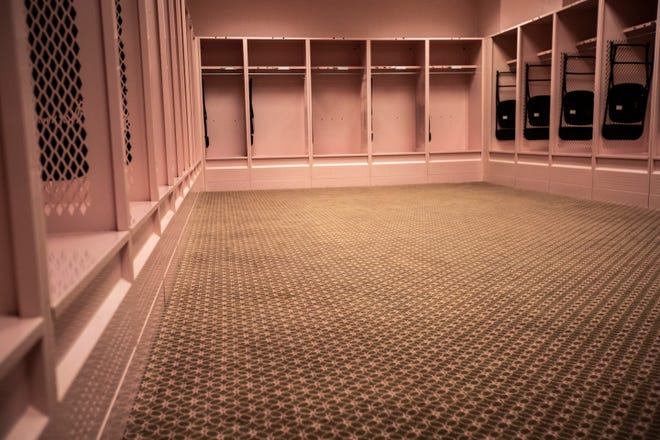 The pink guest locker room is pictured during a behind the scenes tour, Friday, Aug. 23, 2019, at Kinnick Stadium in Iowa City, Iowa.
