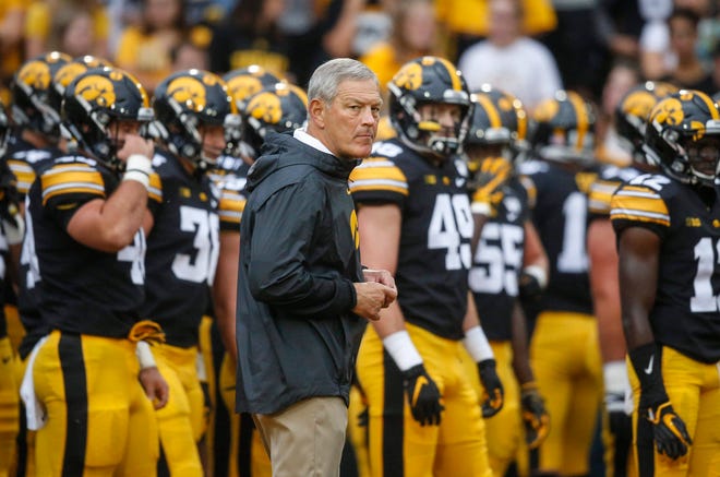 Iowa head football coach Kirk Ferentz observes his team as they warm up prior to kickoff against Miami of Ohio at Kinnick Stadium in Iowa City on Saturday, Aug. 31, 2019.