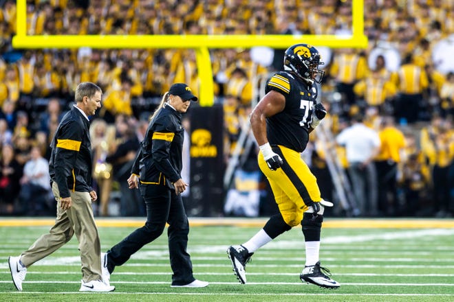Iowa offensive lineman Alaric Jackson (77) jogs off the field to the sideline during a NCAA non conference football game, Saturday, Aug. 31, 2019, at Kinnick Stadium in Iowa City, Iowa.