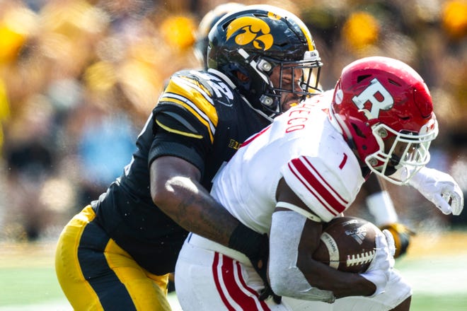 Iowa linebacker Djimon Colbert (32) tackles Rutgers running back Isaih Pacheco (1) during a NCAA Big Ten Conference football game against Rutgers, Saturday, Sept. 7, 2019, at Kinnick Stadium in Iowa City, Iowa.