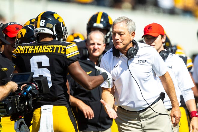 Iowa wide receiver Ihmir Smith-Marsette (6) gets a high-five from Iowa head coach Kirk Ferentz after scoring a touchdown during a NCAA Big Ten Conference football game against Rutgers, Saturday, Sept. 7, 2019, at Kinnick Stadium in Iowa City, Iowa.