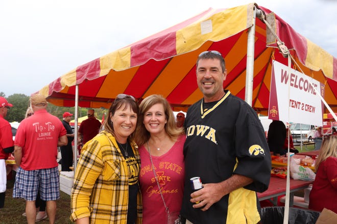 David Miller (right) Sheri Miller (left) and Kelly Frizzell (middle) before the Iowa State University game against the University of Iowa on Sept. 14.
Photo by Grant Tetmeyer