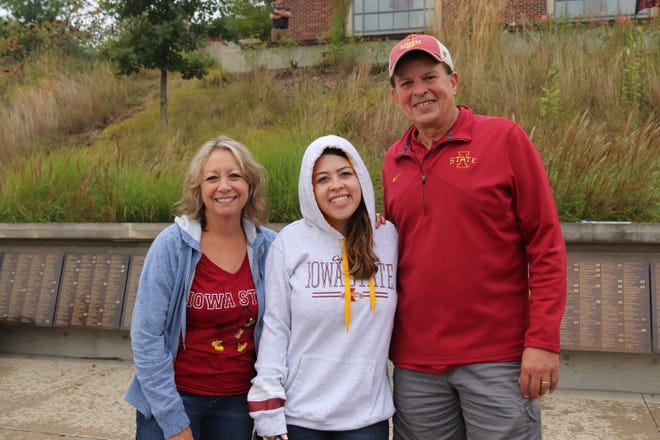 Patty Thompson (left) Morgan Thompson (middle) and Mark Thompson (right) before the Iowa State University game against the University of Iowa on Sept. 14.
Photo by Grant Tetmeyer