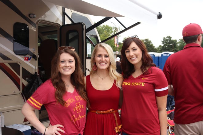 Ashley Ahrens (left) Presley Moffitt (middle) and Megan Viau (right)  before the Iowa State University game against the University of Iowa on Sept. 14.
Photo by Grant Tetmeyer