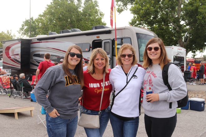 Grace Hall (from left) Connie Thompson, Susan Eckles and Elyse Rice before the Iowa State University game against the University of Iowa on Sept. 14.
Photo by Grant Tetmeyer