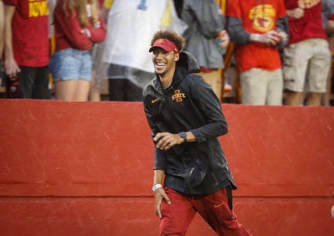 Iowa State basketball player George Conditt cheers up the football fans during a lightning delay against Iowa on Saturday, Sept. 14, 2019, at Jack Trice Stadium in Ames.