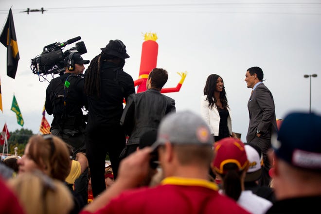 ESPN's Maria Taylor and Desmond Howard film a segment of  "College GameDay"  outside Jack trice Stadium before the Iowa vs. Iowa State football game on Saturday, Sep. 14, 2019, in Ames, Iowa.