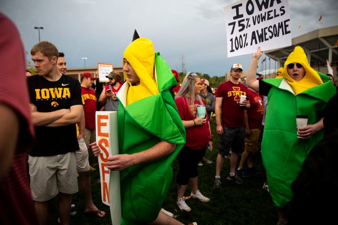 Two people dressed at ears of corn wade through he crowd on the set of ESPN's "College GameDay" before the Iowa vs. Iowa State football game on Saturday, Sep. 14, 2019, outside of Jack Trice Stadium in Ames, Iowa.