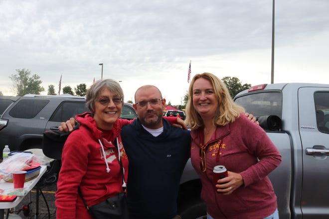 Jill Means (right) Patrick McGill (middle) and Lisa Miebuhr (left) before the Iowa State University game against the University of Iowa on Sept. 14.
Photo by Grant Tetmeyer
