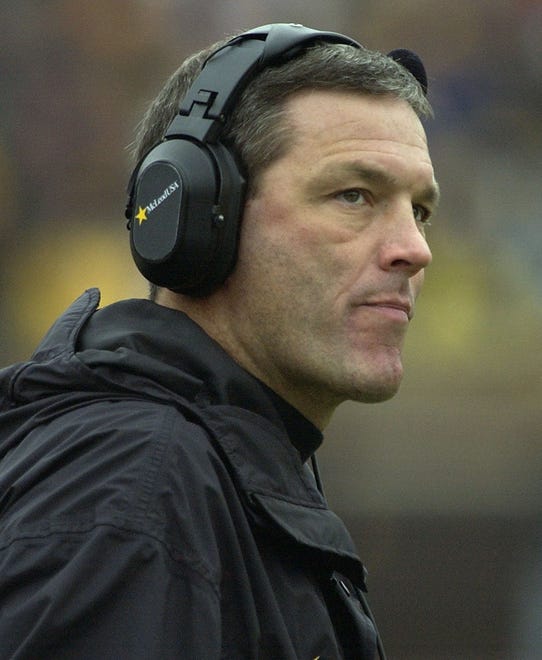 Iowa coach Kirk Ferentz looks on from the sideline during the third quarter in Iowa's 34-9 win over Michigan on Oct. 26, 2002, in Ann Arbor, Michigan.