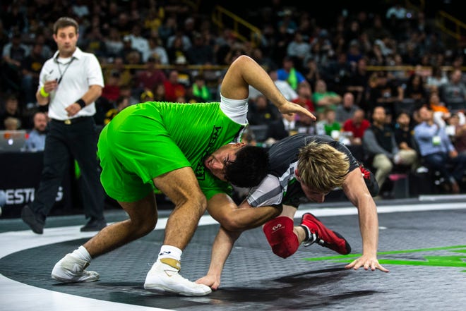 Sonny Santiago, of California, (green) wrestles Travis Mastrogiovanni, of New Jersey, during a match at 152 pounds during Flowrestling's Who's Number One event, Saturday, Oct., 5, 2019, at Carver-Hawkeye Arena in Iowa City, Iowa.