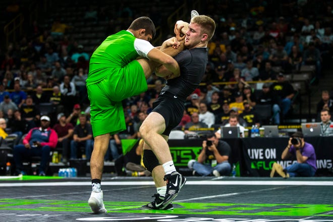 Patrick Kennedy, of Minnesota, wrestles Alex Facundo, of Michigan, at 170 pounds during Flowrestling's Who's Number One event, Saturday, Oct., 5, 2019, at Carver-Hawkeye Arena in Iowa City, Iowa.