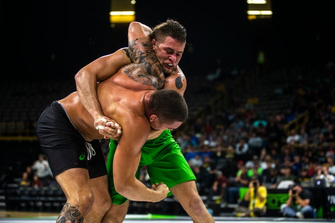 Patrick Downey III (green) competes against Nick Rodriguez during a grappling match during Flowrestling's Who's Number One event, Saturday, Oct., 5, 2019, at Carver-Hawkeye Arena in Iowa City, Iowa.