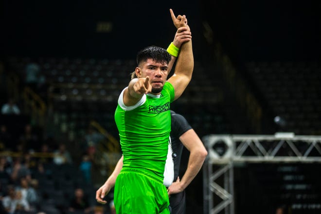 Sonny Santiago, of California, (green) celebrates after defeating Travis Mastrogiovanni, of New Jersey, during a match at 152 pounds during Flowrestling's Who's Number One event, Saturday, Oct., 5, 2019, at Carver-Hawkeye Arena in Iowa City, Iowa.