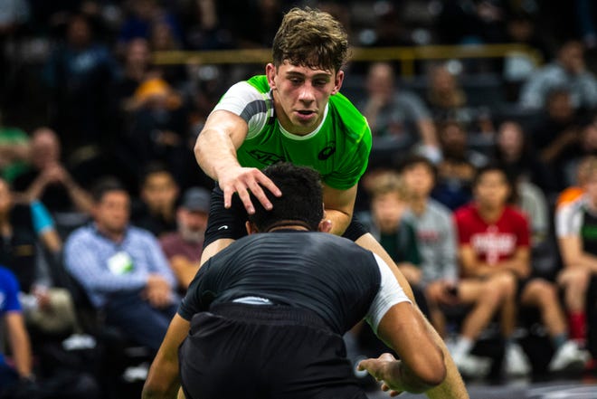 Jesse Mendez, of Indiana, (green) wrestles Shayne Van Ness, of New Jersey, at 132 pounds during Flowrestling's Who's Number One event, Saturday, Oct., 5, 2019, at Carver-Hawkeye Arena in Iowa City, Iowa.