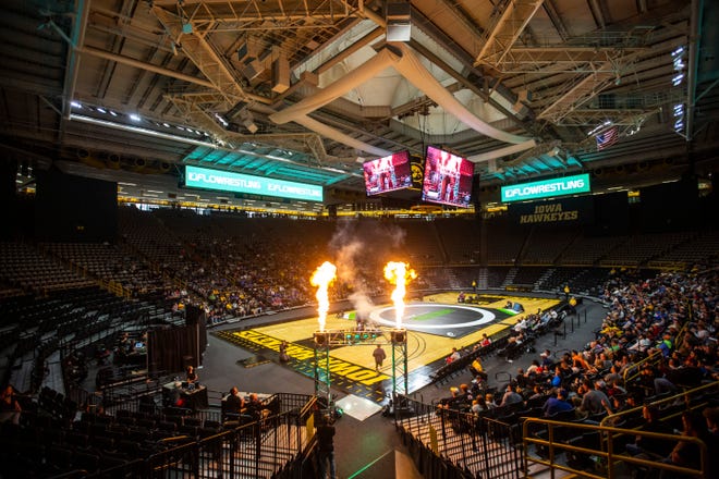 Pyrotechnics go off while a wrestler is introduced during Flowrestling's Who's Number One event, Saturday, Oct., 5, 2019, at Carver-Hawkeye Arena in Iowa City, Iowa.