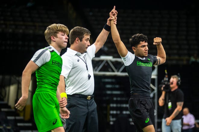 Richard Figueroa, of California, celebrates after winning a match at 113 pounds against Stevo Poulin, of New York, during Flowrestling's Who's Number One event, Saturday, Oct., 5, 2019, at Carver-Hawkeye Arena in Iowa City, Iowa.