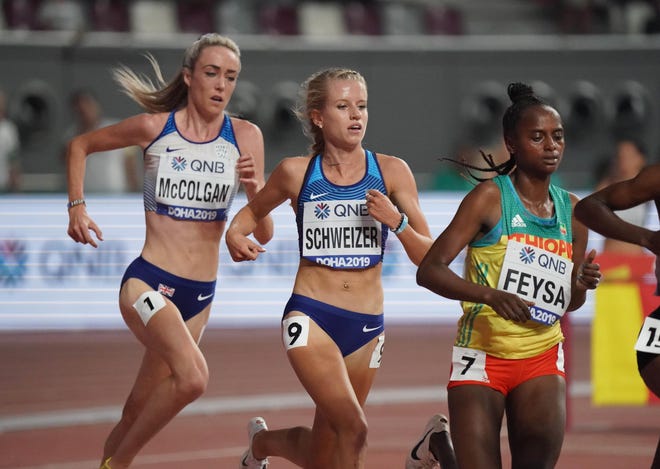 Karissa Schweizer (middle), running in the first heat of the 5,000 meters on Wednesday in Doha, Qatar.