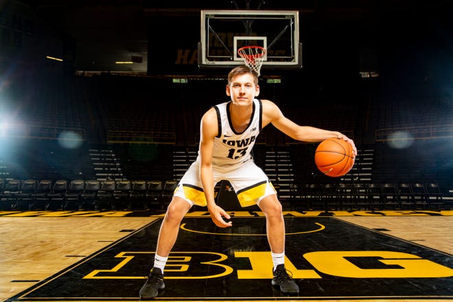 Austin Ash stands for a portrait during Iowa basketball during media day in Iowa City Wednesday, Oct. 9, 2019.