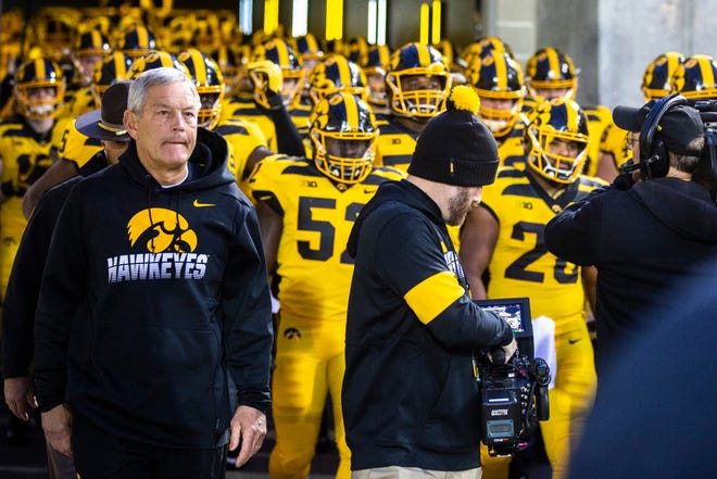 Iowa head coach Kirk Ferentz walks out of the tunnel with players during a NCAA Big Ten Conference football game between the Iowa Hawkeyes and Penn State, Saturday, Oct., 12, 2019, at Kinnick Stadium in Iowa City, Iowa.