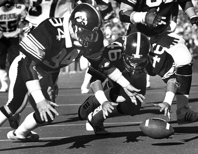 James Erb, left, blocks a Purdue punt and Tracy Crocker (46) turns it into a touchdown recovery Nov. 7, 1981, against Purdue.