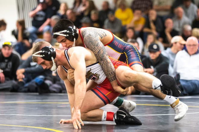 Iowa's Pat Lugo, right, wrestles Zach Axmear during the first day of preseason Hawkeye wrestling matches, Thursday, Nov., 7, 2019, inside the Dan Gable Wrestling Complex at Carver-Hawkeye Arena in Iowa City, Iowa.