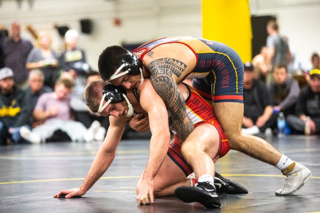 Iowa's Pat Lugo, top, wrestles Zach Axmear during the first day of preseason Hawkeye wrestling matches, Thursday, Nov., 7, 2019, inside the Dan Gable Wrestling Complex at Carver-Hawkeye Arena in Iowa City, Iowa.