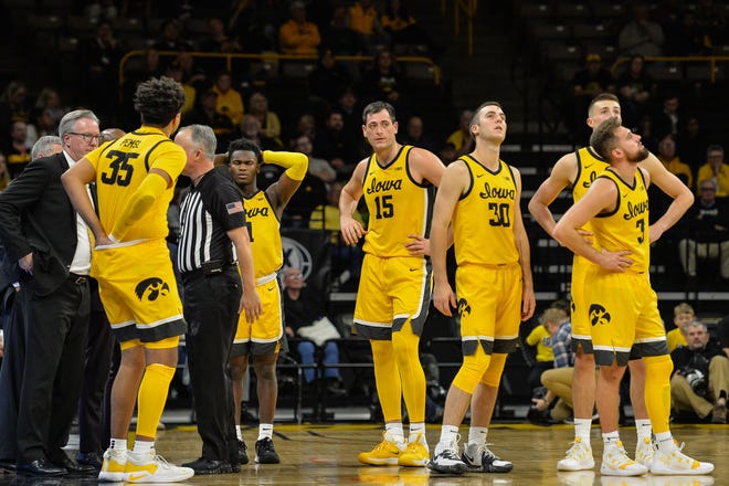 Nov 11, 2019; Iowa City, IA, USA; Iowa Hawkeyes forward Cordell Pemsl (35) and guard Joe Toussaint (1) and forward Ryan Kriener (15) and guard Connor McCaffery (30) and guard Jordan Bohannon (3) and head coach Fran McCaffery react after a technical foul called during the second half against the DePaul Blue Demons at Carver-Hawkeye Arena.