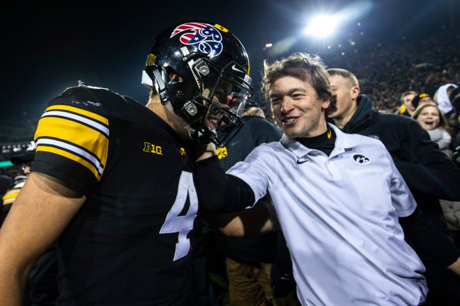 Iowa quarterback Nate Stanley (4) smiles after a NCAA Big Ten Conference football game, Saturday, Nov., 16, 2019, at Kinnick Stadium in Iowa City, Iowa. The Hawkeyes defeated Minnesota, 23-19.