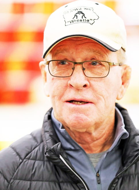 Dan Gable, who coached University of Iowa to 15 NCAA Division titles, meets with fans during a meet and greet with Iowa wrestling legend Dan Gable and a 3,000-pound wheel of aged white cheddar cheese sculpture of him on Sunday, Nov. 17, 2019, at the Hy-Vee, 410 N. Ankeny Blvd., in Ankeny.