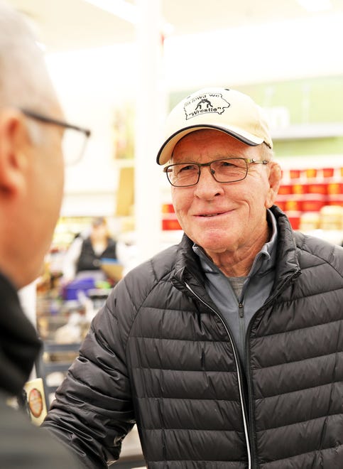 Dan Gable visits with fans during a meet and greet with Iowa wrestling legend Dan Gable and a 3,000-pound wheel of aged white cheddar cheese sculpture of him on Sunday, Nov. 17, 2019, at the Hy-Vee, 410 N. Ankeny Blvd., in Ankeny.