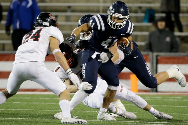 Bay Port's Isaiah Gash (41) runs the ball against Muskego in the WIAA Division 1 state championship game in November.