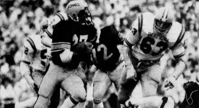 Iowa tailback Ernie Sheeler tries to turn the corner and get around Iowa State defensive lineman Mike Stensrud in the first quarter of the 1977 Cy-Hawk football game, which Iowa won 12-10.
