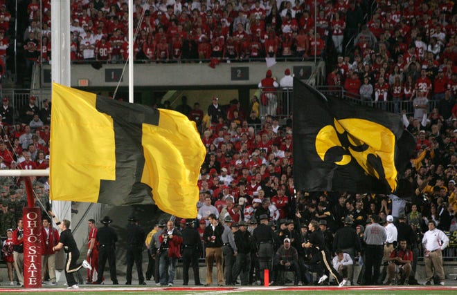 Iowa cheerleaders display team flags after the Hawkeyes scored a touchdown against Ohio State during the fourth quarter of their game Saturday, Nov. 14, 2009, in Columbus, Ohio. Ohio State won the game 27-24 in overtime.