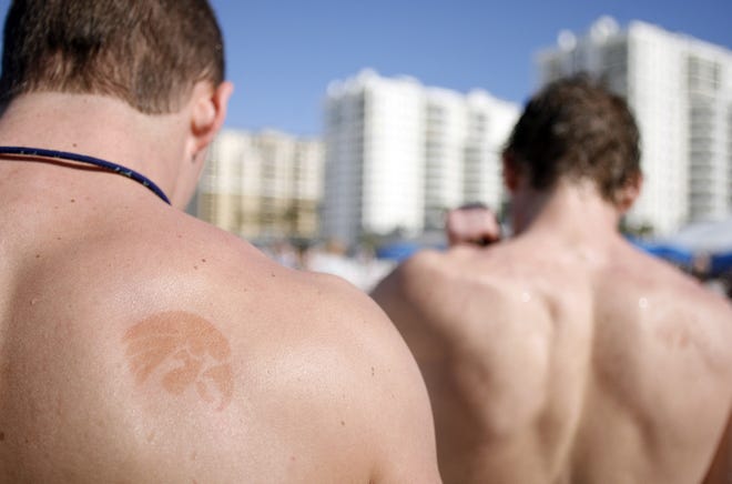 UI sophomore Ryan Lindgard sports a henna art tatoo of a tigerhawk during the Outback Bowl "Beach Day" at Clearwater Beach, Tuesday, Dec. 30, 2008, in Clearwater, Fla.